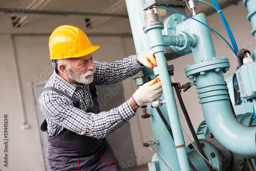 Senior man industry engineer worker working and repairing in the factory