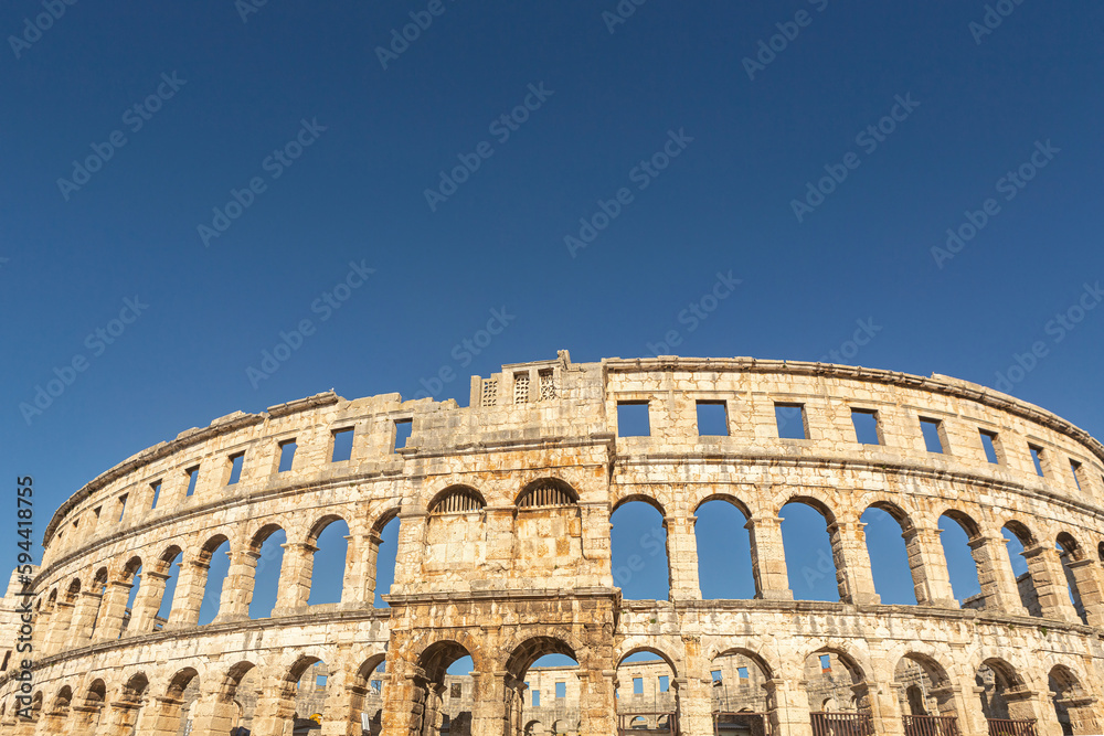 Amphitheatre of Pula, croatia, against blue sky in early spring