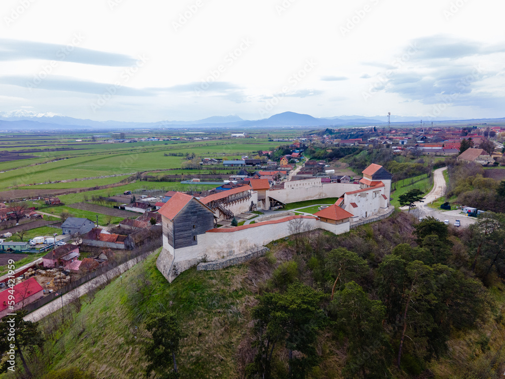 Fototapeta premium Aerial photography of the Feldioara medieval outpost, located in Brasov county, Romania. Photography was shot from a drone with camera level for a landscape view of the fortification.