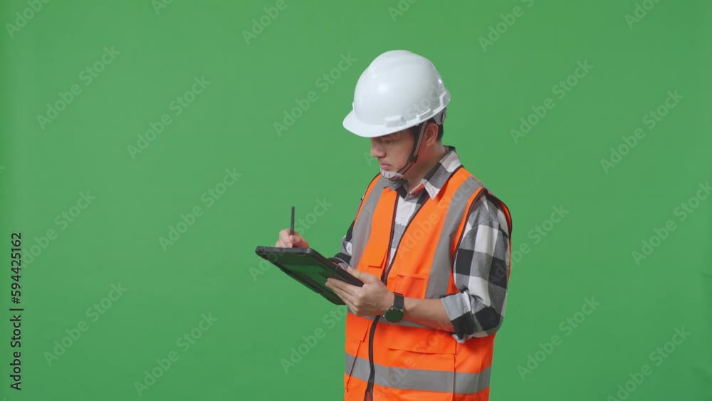 Side View Of Asian Male Engineer With Safety Helmet Taking Note On The Tablet And Looking Around While Standing In The Green Screen Background Studio
Side View Of Asian Male Engineer With Safety Helmet Taking Note On The Tablet And Looking Around While Standing In The Green Screen Background Studio