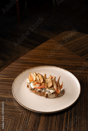 Delicious bruschetta with tomato cheese and fried chicken in a restaurant Healthy food gastronomy