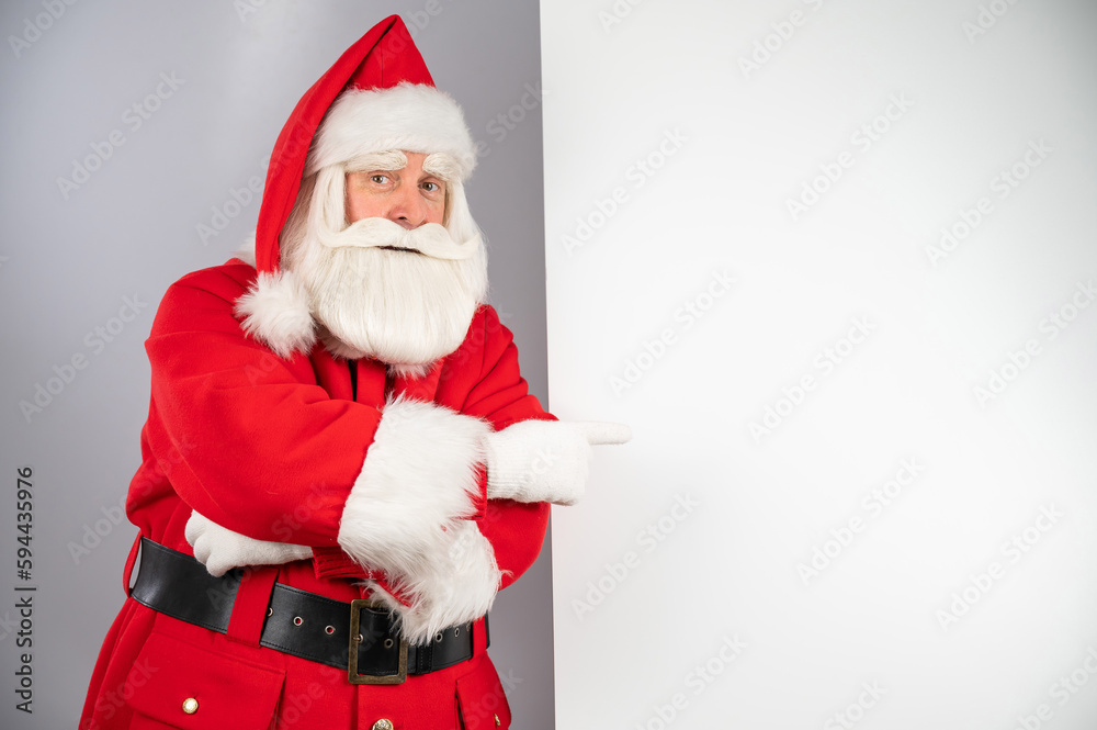 Santa claus points to an empty space. Christmas advertisement. Santa claus points to an empty space. Christmas advertisement.