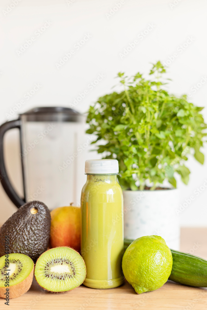 Healthy fresh avocado, kiwi, banana and cucumber green smoothie with assorted ingredients. Superfood detox and diet concept. Healthy fresh avocado, kiwi, banana and cucumber green smoothie with assorted ingredients. Superfood detox and diet concept.
