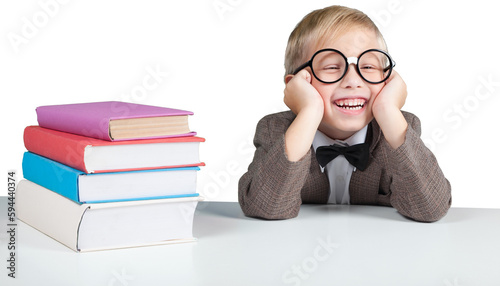 Portrait of a cute young boy in glasses with books over background