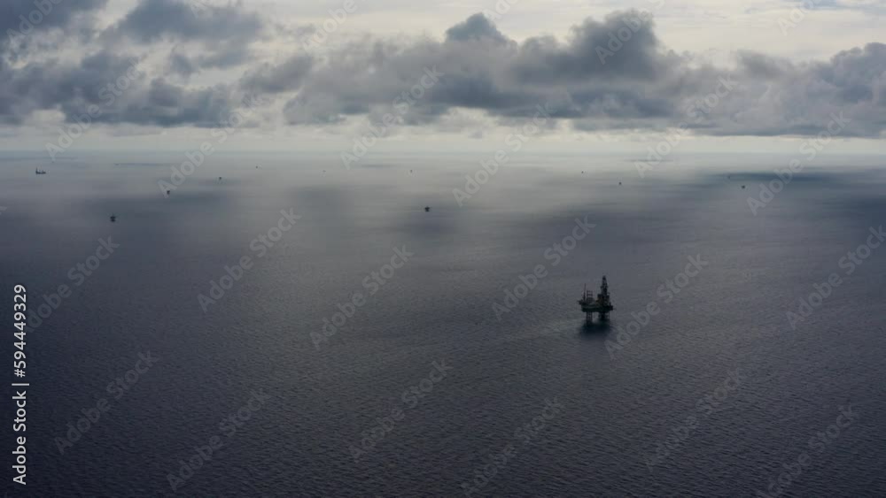 Jack up drilling rig and production platform in the middle of the ocean during couldy time
Jack up drilling rig and production platform in the middle of the ocean during couldy time