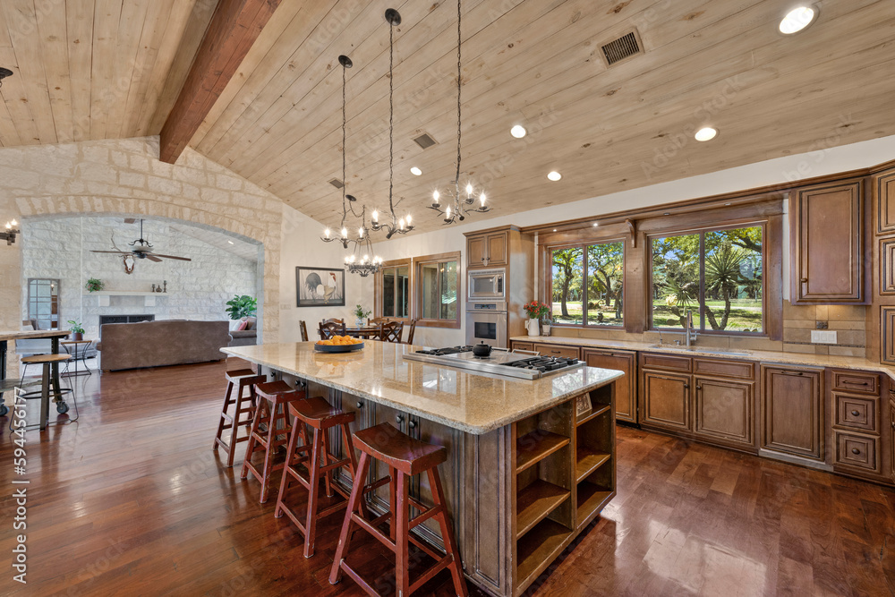 a farmhouse kitchen with wood floors and accents