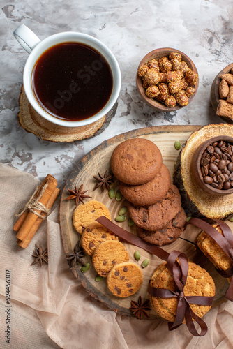 Fototapeta Naklejka Na Ścianę i Meble -  top view sweet biscuits with nuts and cup of coffee on light background colors cocoa sugar tea cake cookie sweet pie