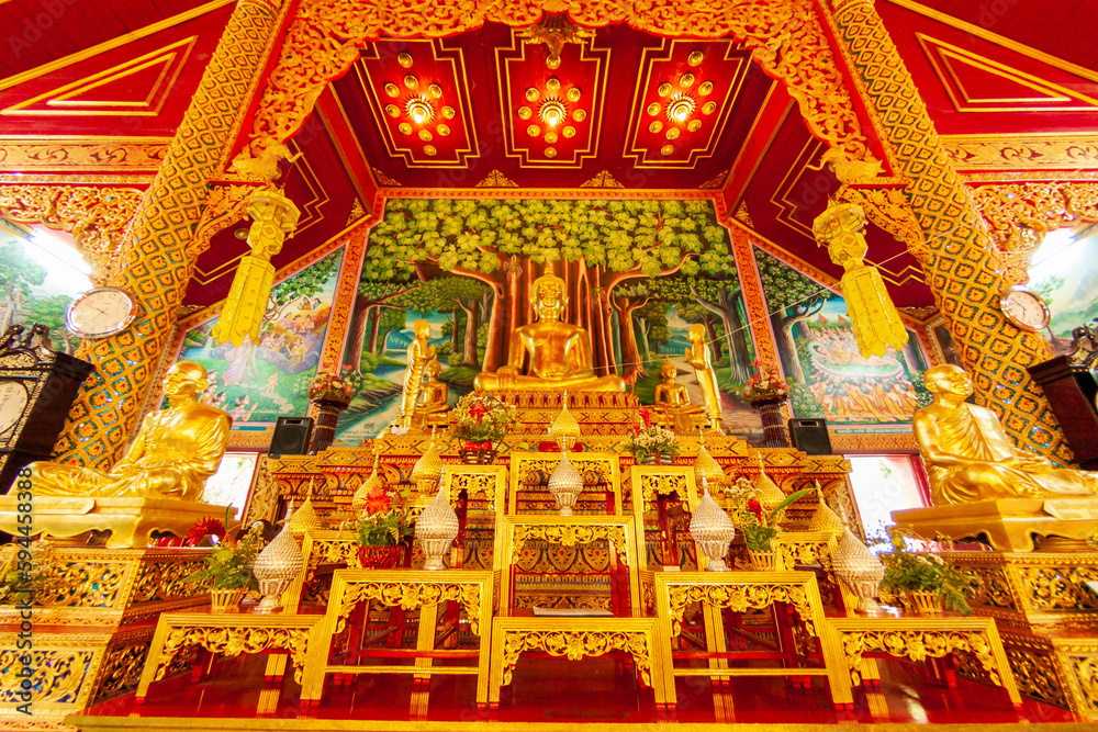 Chiang Mai, Thailand. Wat Sri Soda. Golden altar and Buddhas.