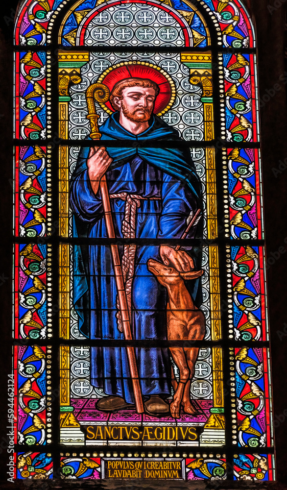Saint Giles Aegidius stained glass, Nimes Cathedral, Gard, France. Church created 1100 AD. Saint Giles hermit in Nimes know for miracles.