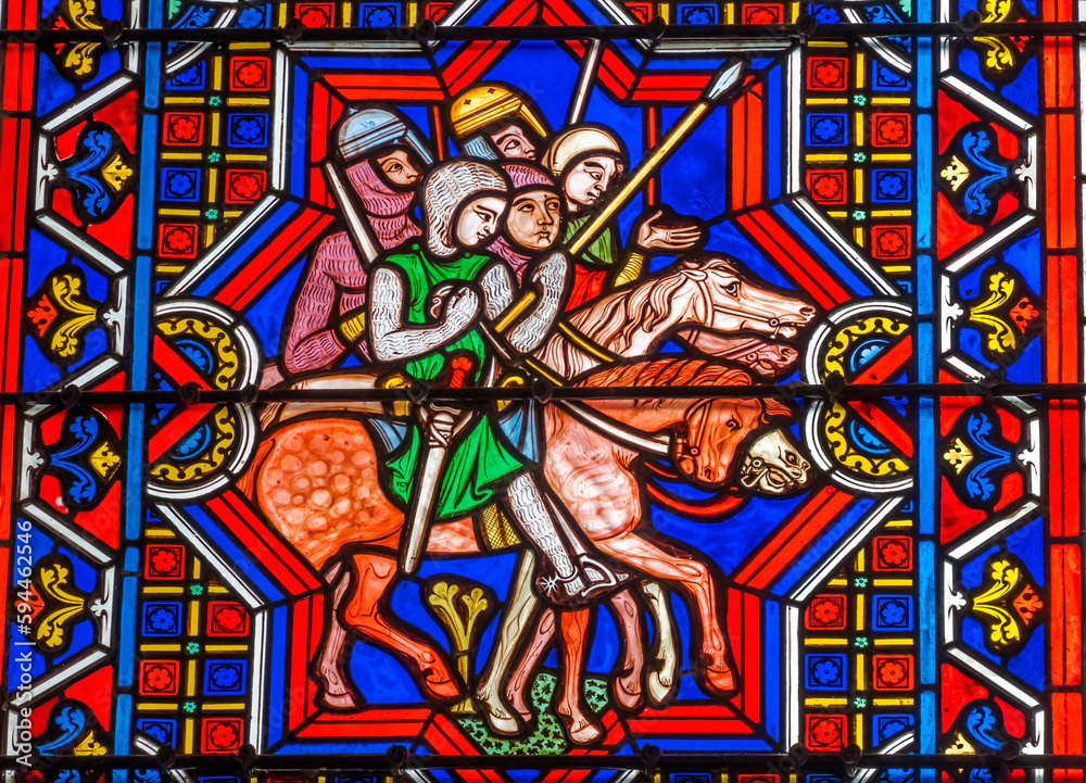Colorful knights horses stained glass, Bayeux Cathedral, Bayeux, Normandy, France. Catholic church consecrated in 1077