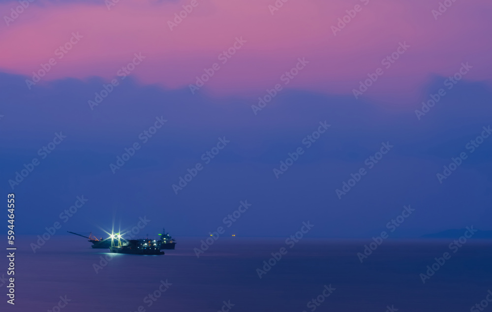 Dredger vessel on the sea in twilight