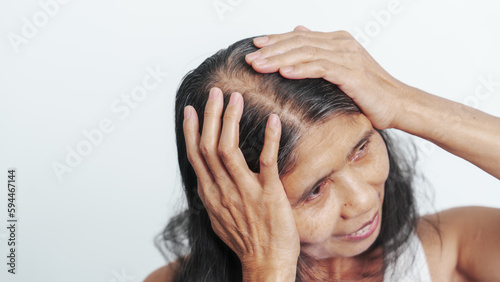 Close up older elderly asian chinese woman gray hair worry cancer worry about hair loss