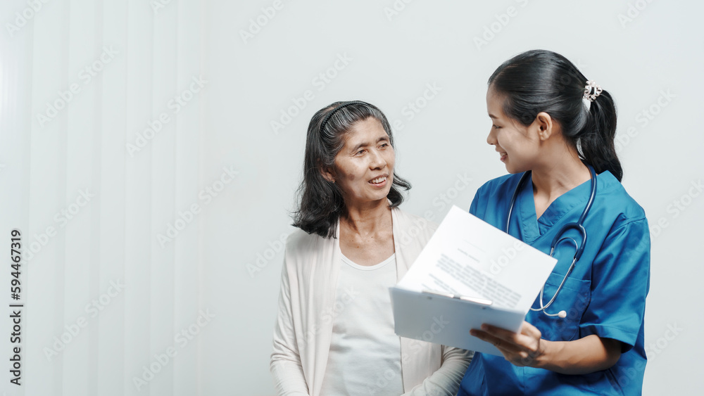 Senior older elderly patient asian grandmother woman with nurse consulting, safety and support of help, trust of breast cancer awareness, encourage Senior older elderly patient asian grandmother woman with nurse consulting, safety and support of help, trust of breast cancer awareness, encourage