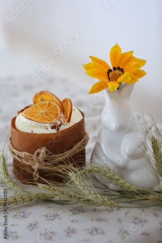 Homemade baking on the table  porcelain rabbits  yellow flower  ears of corn  background  background image  photo  wallpaper