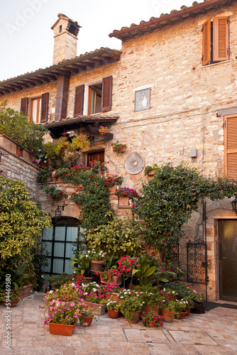 Italy  Umbria. Colorful flowers outside a home in the Italian hill town of Assisi.