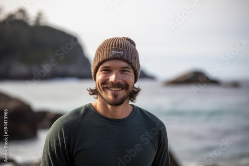 Lifestyle portrait photography of a grinning man in his 30s wearing a warm beanie or knit hat against an island resort or vacation background. Generative AI