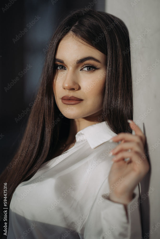 Portrait of beautiful girl with long black hair. Casual portrait of pretty caucasian girl