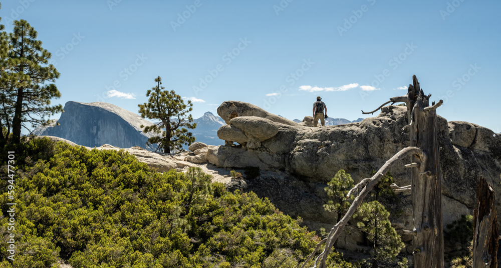 Hiker with Camera Stops at Yosemite Point