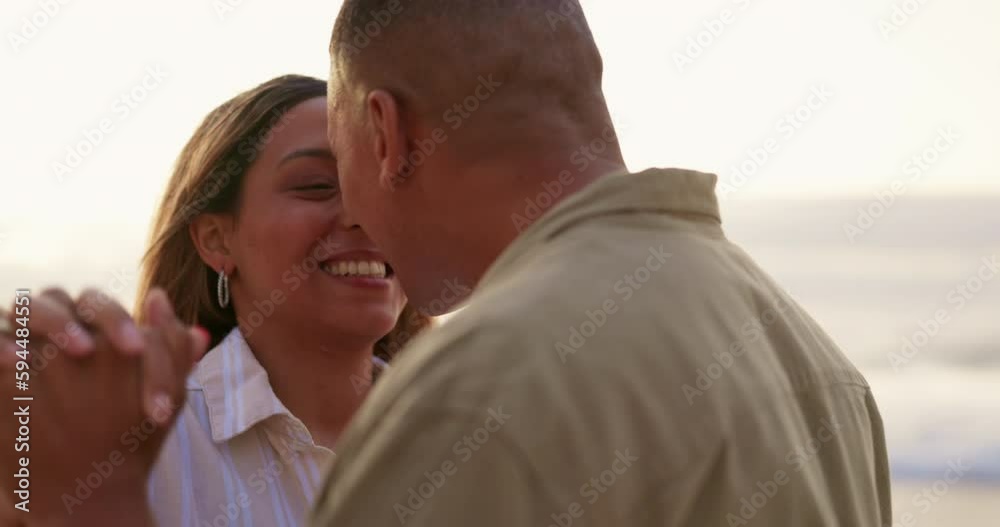 Dance, love and kiss with couple on beach for romance, summer vacation and celebration. Bonding, affectionate and happiness with man and woman dancing on ocean holiday, holding hands and support Dance, love and kiss with couple on beach for romance, summer vacation and celebration. Bonding, affectionate and happiness with man and woman dancing on ocean holiday, holding hands and support