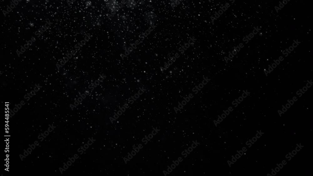 A lot of small real snowflakes falling slowly to the right in front of a black screen. Isolated overlay. A lot of small real snowflakes falling slowly to the right in front of a black screen. Isolated overlay.