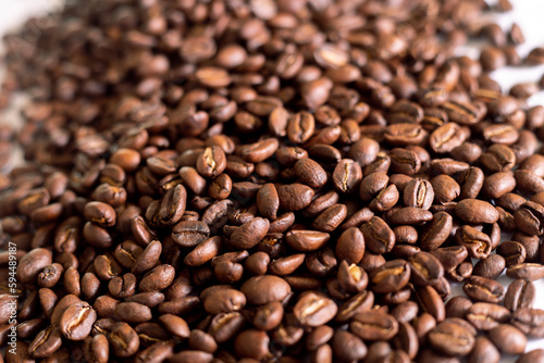 Roasted coffee beans background  colombian coffe rought coffee