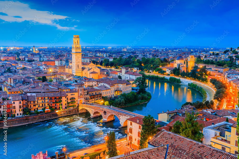 Verona, Italy. View of Verona old town and Adige river at dusk.