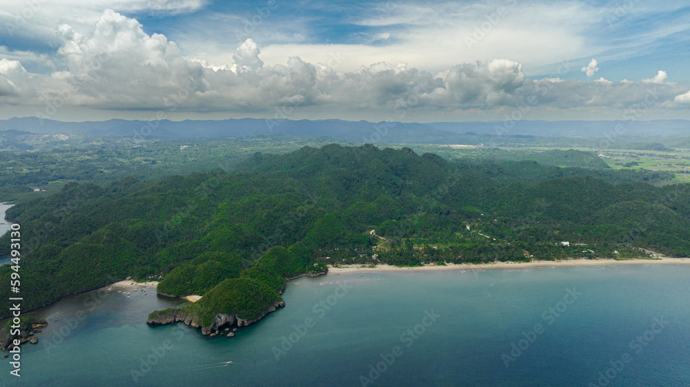 Aerial drone of coast of the island with tropical vegetation and the beach. Negros, Philippines.