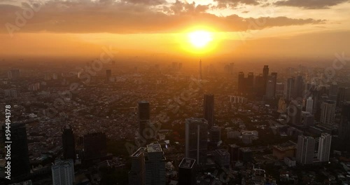 Wallpaper Mural Aerial drone of sunset over Jakarta. Cityscape with skyscrapers. Indonesia. Torontodigital.ca
