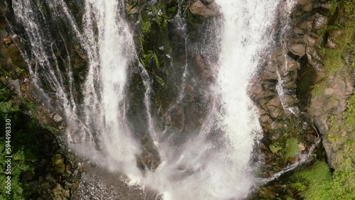 A tropical waterfall in the jungles in slow motion. Efrata Falls. Sumatra. Samosir, Indonesia. photo