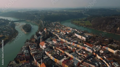 Wasserburg am Inn, medieval old town in Bavaria, Germany surrounded by scenic river bend. Aerial drone footage of European houses, castle, bridge, church and market square in early morning fog. 4K UHD photo