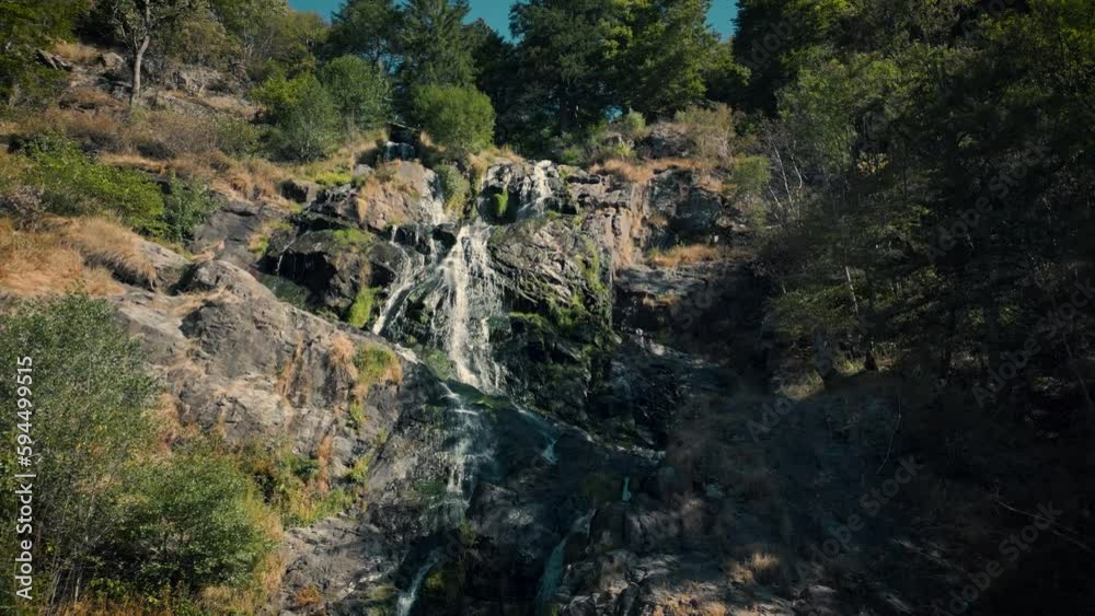 Slow aerial flying backwards from Todtnau Waterfall in sunny day, Germany Slow aerial flying backwards from Todtnau Waterfall in sunny day, Germany