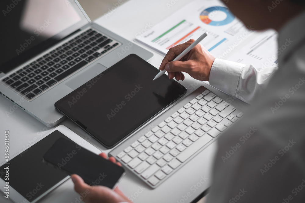 Close up of business man hand using electronic pen with tablet. business and technology concept Close up of business man hand using electronic pen with tablet. business and technology concept