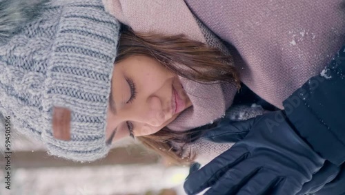 Little girl trying to stay warm at Obersee Switzerland vertical video photo