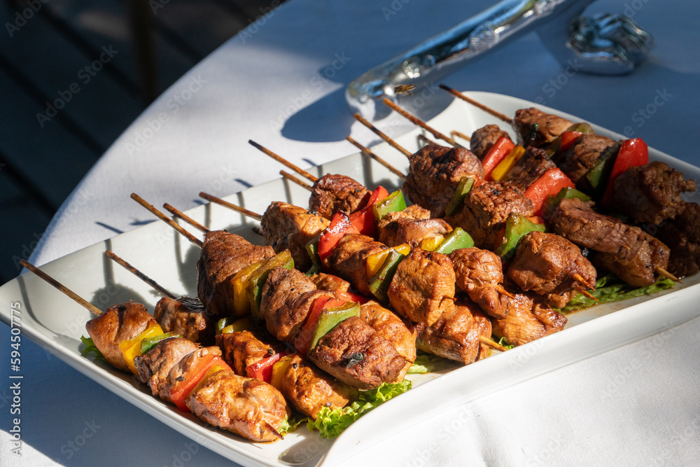 Meat skewers on a plate from a luxury safari camp in South Africa. 