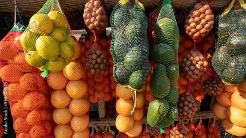 a roadside farmers market in South Africa displays fruits and vegetables for purchase. 