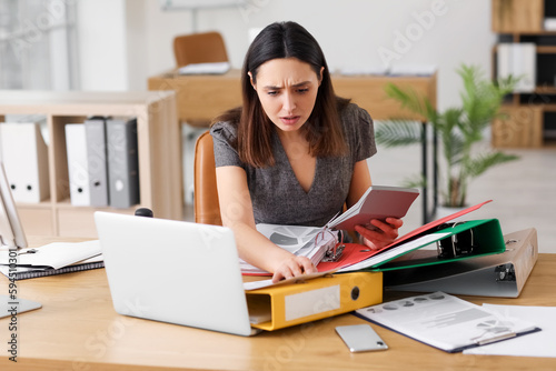 Stressed female accountant ...