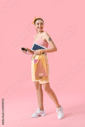Pretty young woman charging...