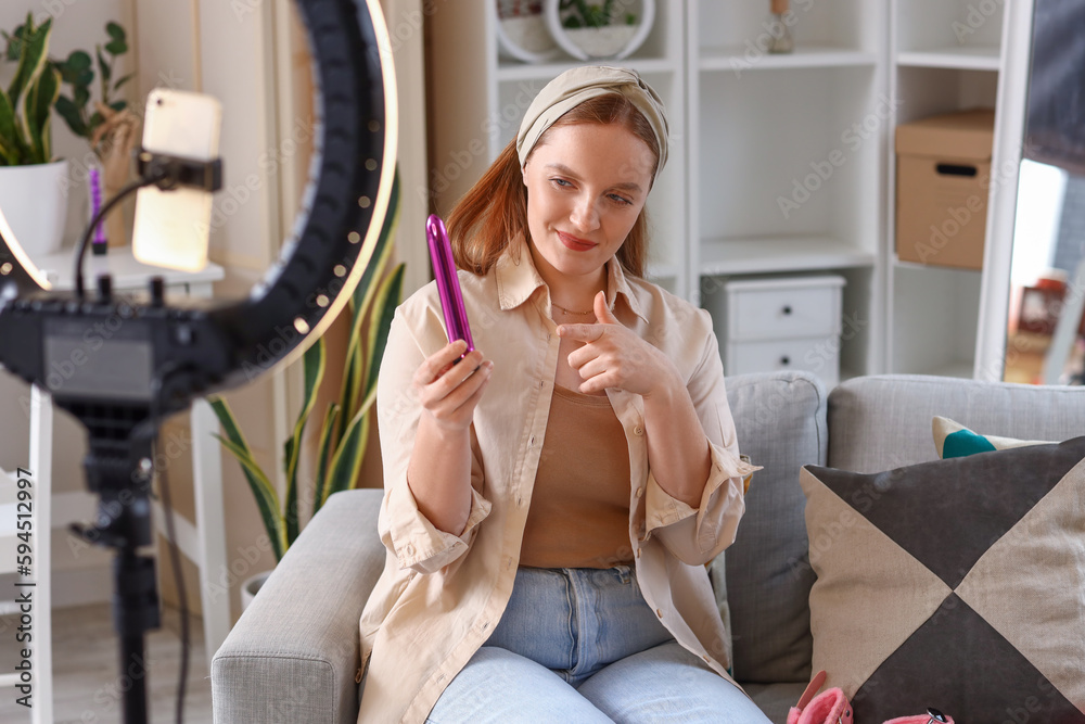 Female blogger making video review of vibrator at home Female blogger making video review of vibrator at home
