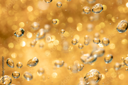 Golden abstract sparkles or glitter lights Defocused circles bokeh