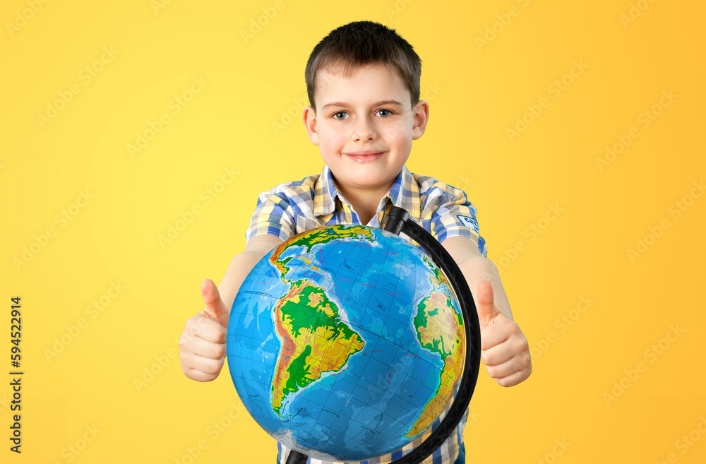 Cheerful student child with globe. School concept. Cheerful student child with globe. School concept.