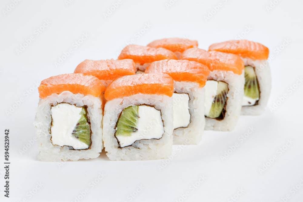 Japanese food, tasty of meal for lunch. Seafood. Philadelphia roll, salmon, soft cheese and kiwi Japanese food, tasty of meal for lunch. Seafood. Philadelphia roll, salmon, soft cheese and kiwi