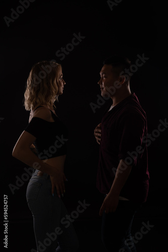 man and woman dance bachata kizomba latina in the dark © dmitriisimakov