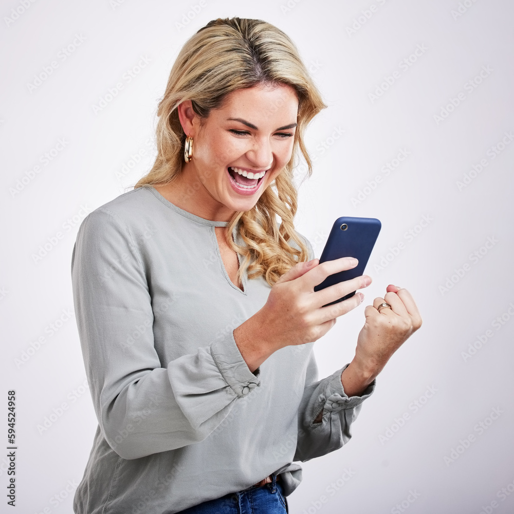 Happy woman, phone and celebration for winning, good news or sale against a white studio background. Excited female with smile on mobile smartphone app in win, discount or bonus promotion and victory Happy woman, phone and celebration for winning, good news or sale against a white studio background. Excited female with smile on mobile smartphone app in win, discount or bonus promotion and victory