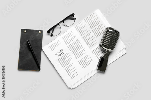 Newspaper with microphone, ...