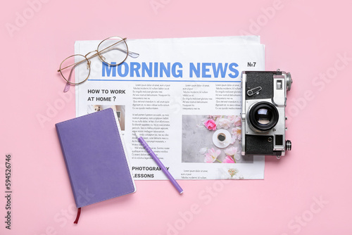 Newspaper with photo camera...