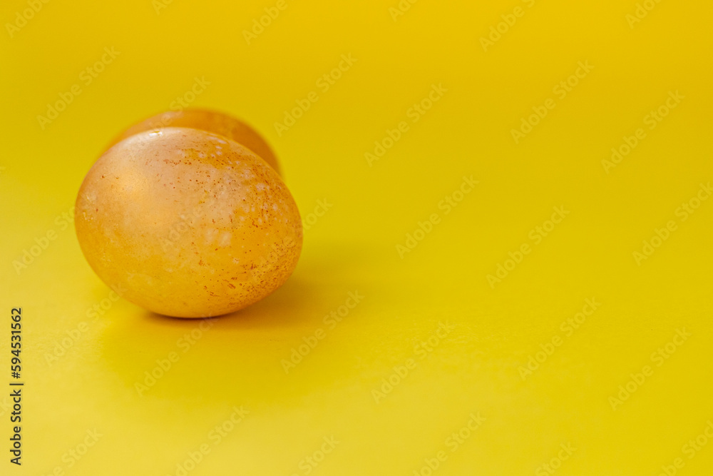 Yellow eggs on bright yellow background. Copy space for product display, mock up. Yellow background to design key visual layout Yellow eggs on bright yellow background. Copy space for product display, mock up. Yellow background to design key visual layout