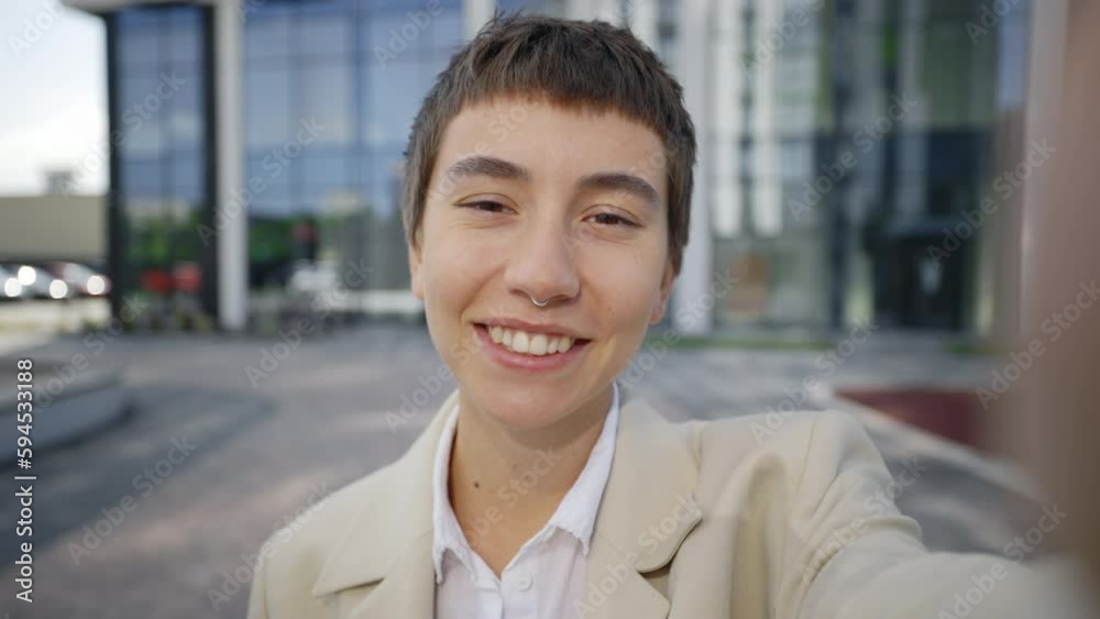 Cheerful Young Caucasian Office Lady Having Video Chat Using Smartphone, Waving at Camera. POV of Attractine Happy Businesswoman Talking and Surprised Looking at Camera While Standing Outside Cheerful Young Caucasian Office Lady Having Video Chat Using Smartphone, Waving at Camera. POV of Attractine Happy Businesswoman Talking and Surprised Looking at Camera While Standing Outside