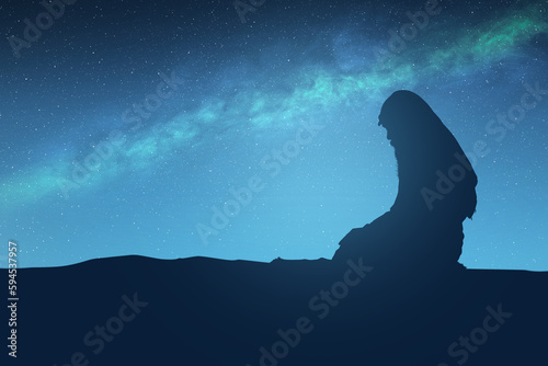 Photography Silhouette of a Muslim man with a beard wearing keffiyeh with agal in a praying