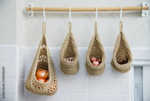 vegetable garlic onion hanger in white kitchen home apartment residential decoration interier design