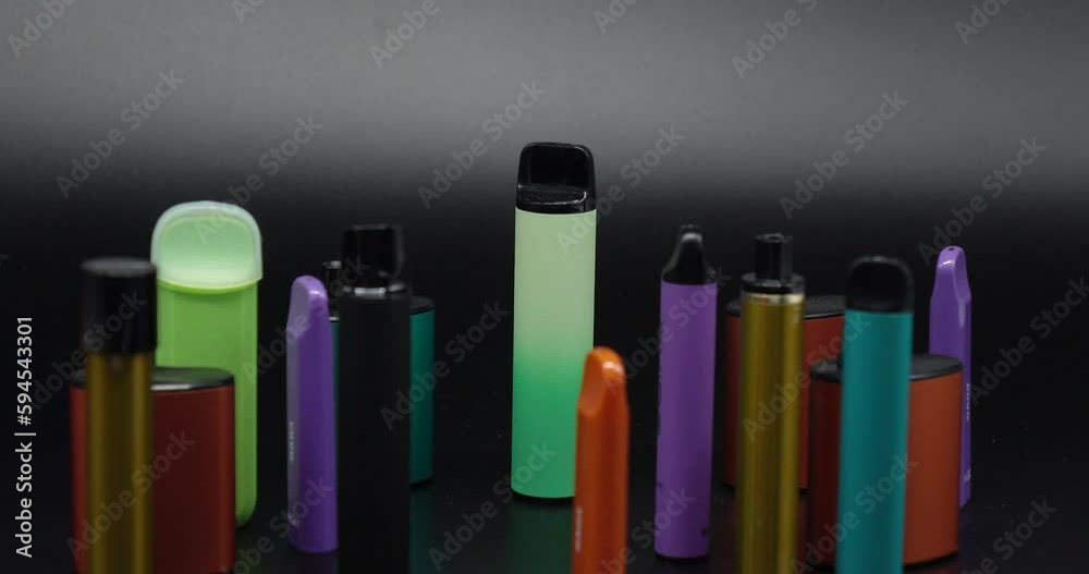 A lot of electronic cigarettes and vapes . The concept of bad habits. A lot of electronic cigarettes and vapes . The concept of bad habits.